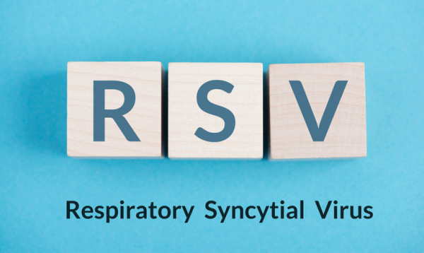 3 wooden blocks with the letters RSV and the words Respiratory Syncytial Virus on a light blue background